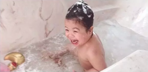 Baby Rosie laughing in bathtub