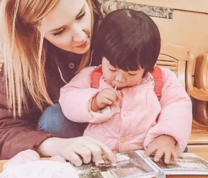 Rosie's mom showing her old family photos